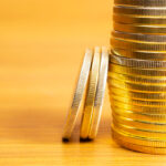 rows-stacks-coins-with-blurred-background-blank-space